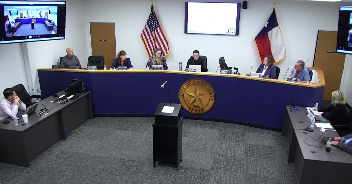 The Lago Vista City Council at the dais during its March 2, 2026, special meeting on complaints against a council member, seen from the back of the council chambers